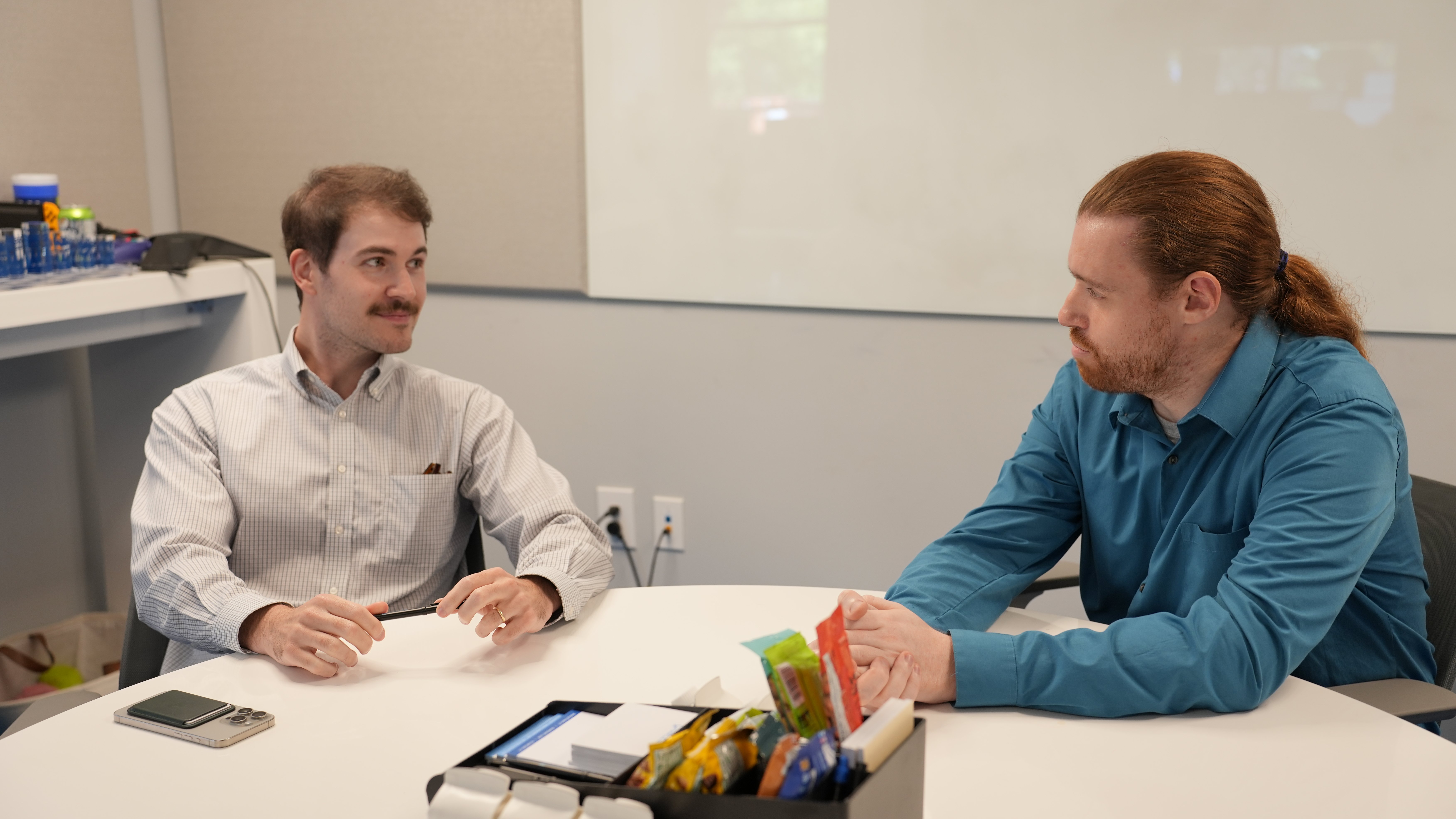 IT Professionals discussing compliance plans for cmmc