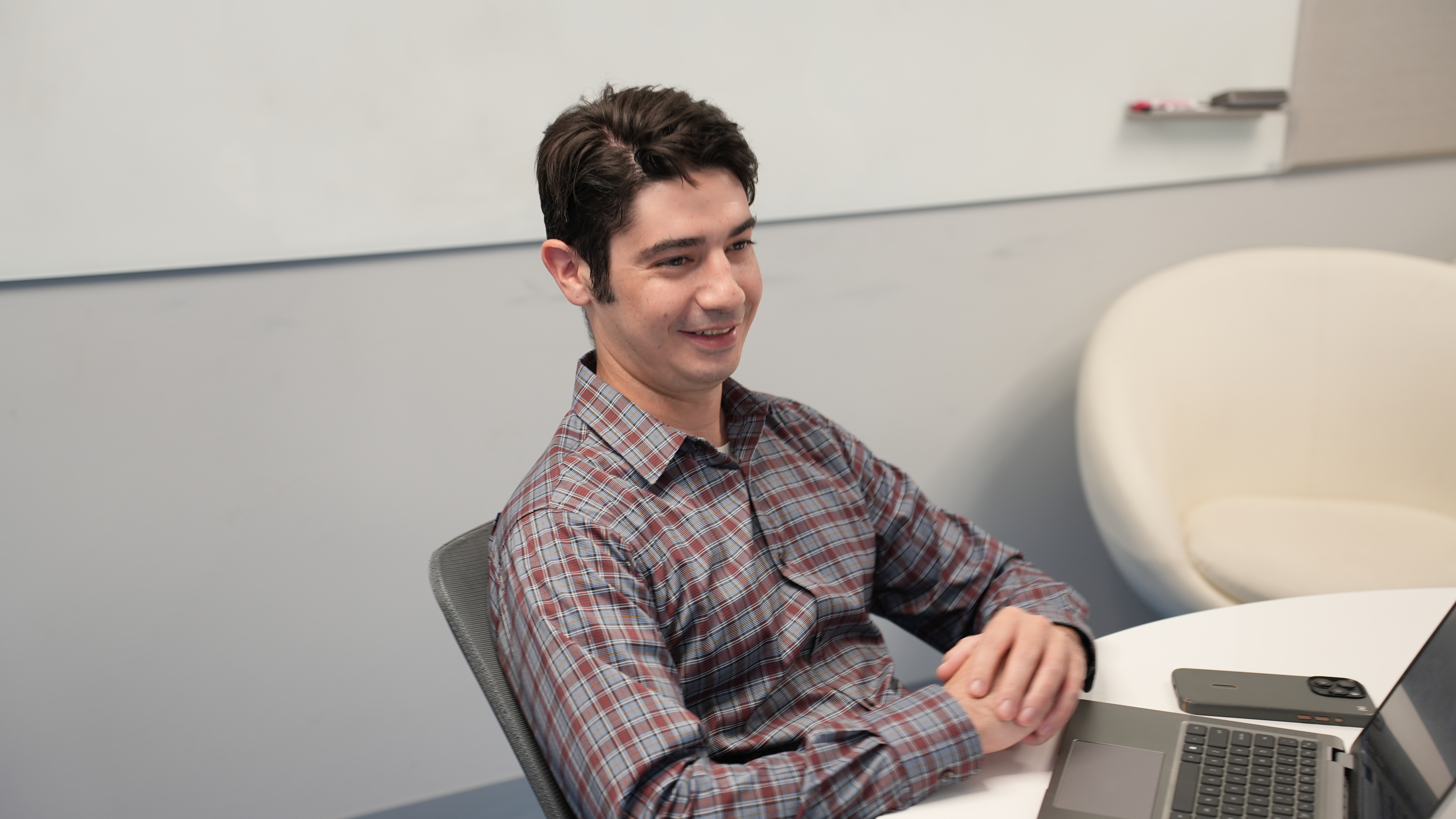 IT Security Professional sitting at table discussing it security